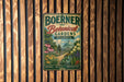 A vintage-style metal sign for Boerner Botanical Gardens in Wisconsin, featuring a lush garden scene with various plants and flowers.