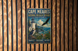 A vintage metal sign for Cape Meares National Wildlife Refuge in Oregon, featuring a lighthouse and an eagle in flight.