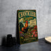 A vintage-style metal sign for "Chanticleer Garden" in Pennsylvania, featuring a rooster and colorful flowers, is displayed on a gray countertop next to some black camera lenses.