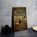 A vintage-style metal sign for Charles M. Russell's National Wildlife Refuge in Montana, featuring an illustration of a deer and an eagle in a mountainous landscape.