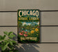 A vintage-style metal sign for the Chicago Botanic Garden in Illinois, featuring a scenic landscape with flowers, plants, and a building.
