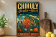A vintage-style metal sign with the text "CHIHULY Garden and Glass WASHINGTON" and an illustration of a greenhouse or garden structure.
