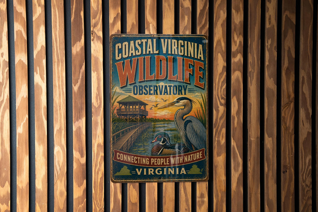 A vintage-style metal sign for the Coastal Virginia Wildlife Observationatory, featuring an illustration of a bird and a wooden structure, mounted on a wooden wall.