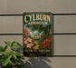 A vintage metal sign for the Baltimore Arboretum, featuring a scenic illustration of a house surrounded by trees and flowers.