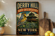 A vintage-style metal sign for the Derby Hill Bird Observatory in New York, featuring a colorful illustration of a bird perched on a branch with a wooden cabin in the background.