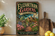 a vintage-style sign for Elizabethan Gardens in North Carolina, with a beautiful garden scene depicted on it. The sign is displayed on a shelf next to a wooden cutting board and some potted plants.