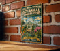 A vintage-style metal sign for the Foellinger-Freimann Botanical Conservatory in Indiana, featuring a garden scene with a greenhouse and flowers.