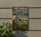 A vintage-style metal sign for the Fort Morgan Birding Trail in Alabama, featuring illustrations of birds and a scenic landscape.