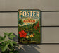 A vintage-style metal sign for Foster Botanical Garden in Hawaii, featuring a tropical landscape with palm trees, flowers, and a waterfall.