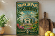 A vintage-style metal sign for Franklin Park Conservatory in Columbus, Ohio, featuring a tropical garden scene with palm trees, colorful flowers, and a large greenhouse structure.
