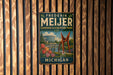 A vintage metal sign for Frederik Mejer Gardens & Sculpture Park in Michigan, featuring a scenic image of the park's landscape and a large sculpture.