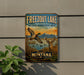 A vintage metal sign for Freezout Lake, Montana, featuring a scenic illustration of ducks and deer in the lake.