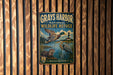 A vintage metal sign for the Grays Harbor National Wildlife Refuge in Washington, featuring illustrations of ducks and other wildlife in a natural setting.