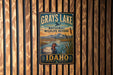 A vintage-style metal sign for the National Wildlife Refuge in Idaho, featuring a duck and a mountain landscape.