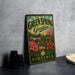 A vintage-style metal sign for "Green Spring Gardens" in Virginia, featuring a garden scene with flowers and a gazebo.