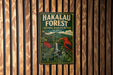 A vintage metal sign for the Hakalau Forest National Wildlife Refuge in Hawaii, featuring an illustration of a bird and lush greenery.