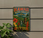 A vintage-style metal sign with the text "Hawaii Tropical Bioreserve and Garden" displayed on a wall, surrounded by tropical plants and flowers.