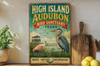 a vintage-style sign for the High Island Audubon Bird Sanctuary in Texas, with illustrations of various bird species and a serene landscape.