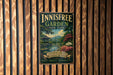 A vintage-style metal sign for the Innisfree Garden in New York, featuring a serene landscape with a pond, trees, and a pagoda.