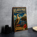 A vintage metal sign for Kilauea Point National Wildlife Refuge in Hawaii, featuring a bird and a lighthouse, is displayed on a gray countertop.