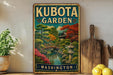 A vintage-style metal sign for Kubota Garden in Washington, featuring a scenic landscape with a bridge, pagoda, and colorful foliage.