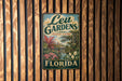 A vintage-style metal sign for Leu Gardens, located in Orlando, Florida.