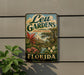A vintage-style metal sign for Leu Gardens, a landmark in Orlando, Florida.