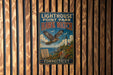A vintage metal sign for Lighthouse Point Park, featuring an illustration of a hawk and the words "Hawk Watch" and "Connecticut".