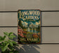 A vintage metal sign for Longwood Gardens in Delaware, featuring an illustration of the gardens and a fountain.