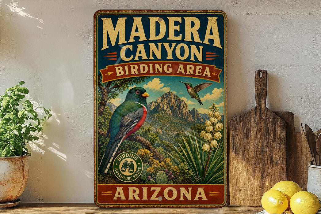 A vintage-style sign for Madera Canyon, Arizona, featuring a colorful illustration of a bird and the text "BIRDING AREA" and "ARIZONA" on a wooden frame.