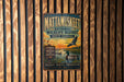 A vintage metal sign for the Mattamukkee National Wildlife Refuge in North Carolina, featuring an illustration of ducks and a sunset over a lake.