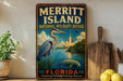 A vintage-style sign for Merritt Island National Wildlife Refuge in Florida, featuring a large blue heron and a rocket launch in the background.