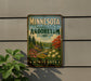 A vintage-style sign for the Minnesota Landscape Arboretum, featuring a scenic landscape with trees, flowers, and a winding path.