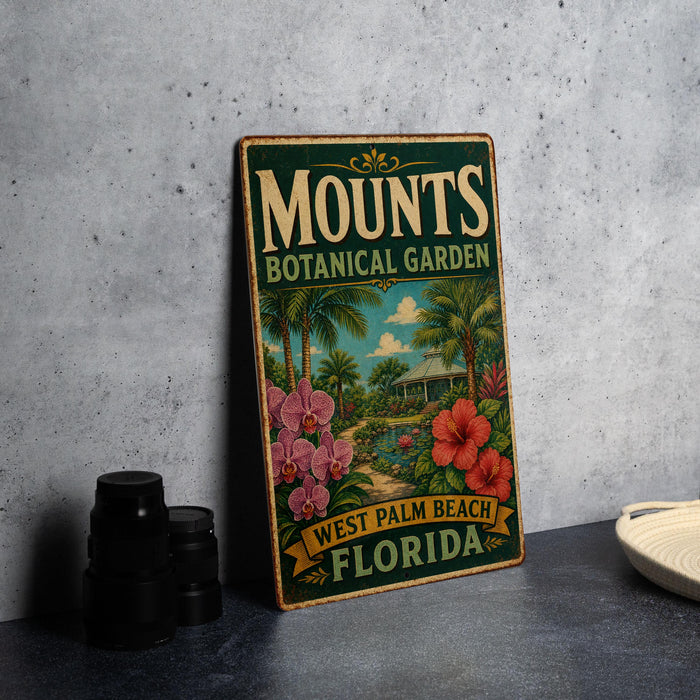 A vintage-style metal sign for the Mounds Botanical Garden in West Palm Beach, Florida, featuring a tropical garden scene with palm trees, flowers, and a gazebo.