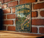 A vintage-style sign for Overland Park Arboretum in Kansas, featuring a garden scene with a gazebo and flowers.