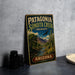A vintage-style metal sign for Patagonia Sonoita Creek Preserve in Arizona, featuring a desert landscape with a cactus and a bird in flight.