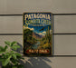 A vintage metal sign for Patagonia Sonoita Creek Preserve in Arizona, featuring a desert landscape with a cactus and a bird in flight.