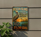 A vintage-style metal sign for Pelican Island National Wildlife Refuge in Florida, featuring an illustration of a pelican and a sunset landscape.