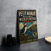 A vintage-style metal sign for the Petit Manan National Wildlife Refuge in Maine, featuring a puffin bird and a lighthouse.