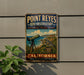 A vintage-style metal sign for Point Reyes Bird Observatory in California, featuring a telescope and a bird in a natural setting.