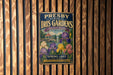 A vintage metal sign for the Presby Memorial Iris Gardens, featuring a colorful illustration of irises and a gazebo, is displayed on a wooden wall.