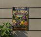A vintage metal sign for the Presby Memorial Iris Gardens, featuring a colorful illustration of the gardens and a scenic view of Spring Lake.