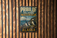 A vintage metal sign for the "Pribilof Islands Seabird Colony" in Alaska, featuring illustrations of puffins and other seabirds.