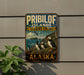 A vintage metal sign for the Pribilof Islands, Alaska, featuring illustrations of puffins and the text "Pribilof Islands Seabird Colony" and "Alaska".
