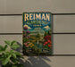 A vintage-style metal sign for Reiman Gardens in Iowa, featuring a greenhouse and colorful flowers, is displayed on a wall next to a plant.