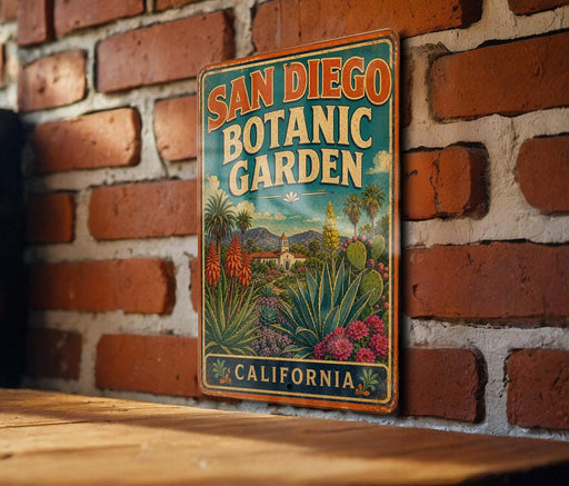 A vintage metal sign for the San Diego Botanic Garden in California, featuring a colorful illustration of the garden's flora and fauna.