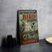 A vintage-style metal sign for the San Francisco Bay Bird Observatory in California, featuring illustrations of birds and the Golden Gate Bridge.