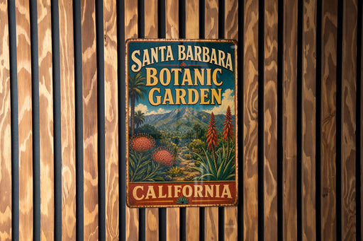 A vintage-style metal sign for Santa Barbara Botanic Garden in California, featuring a tropical landscape with palm trees and colorful flowers.