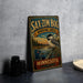 A vintage-style metal sign for the Sax-Zim Bog Birding Area in Minnesota, featuring a bird illustration and text.