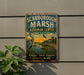 A vintage metal sign for the Audubon Center in Maine, featuring an illustration of a heron and a scenic landscape.